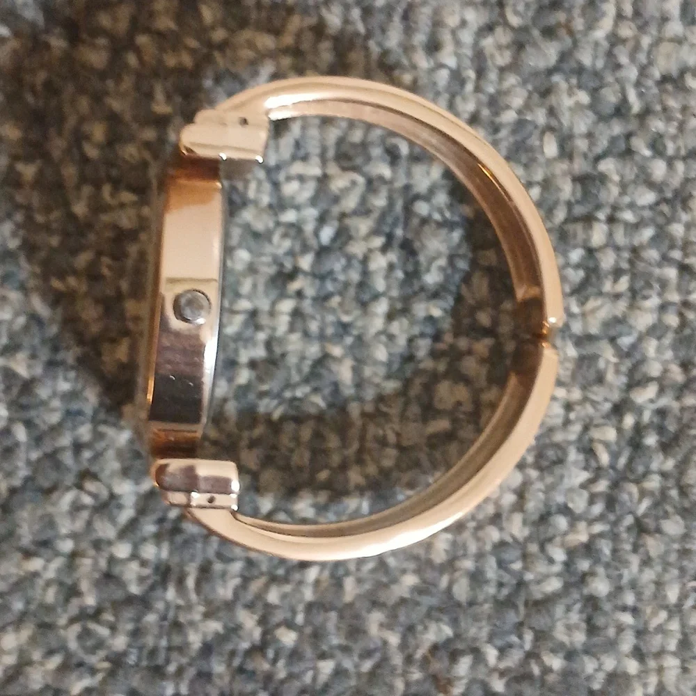 Peck & Peck rose gold tone with white face women's open cuff watch
